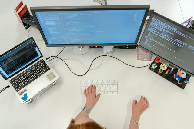 individual sitting at a workstation